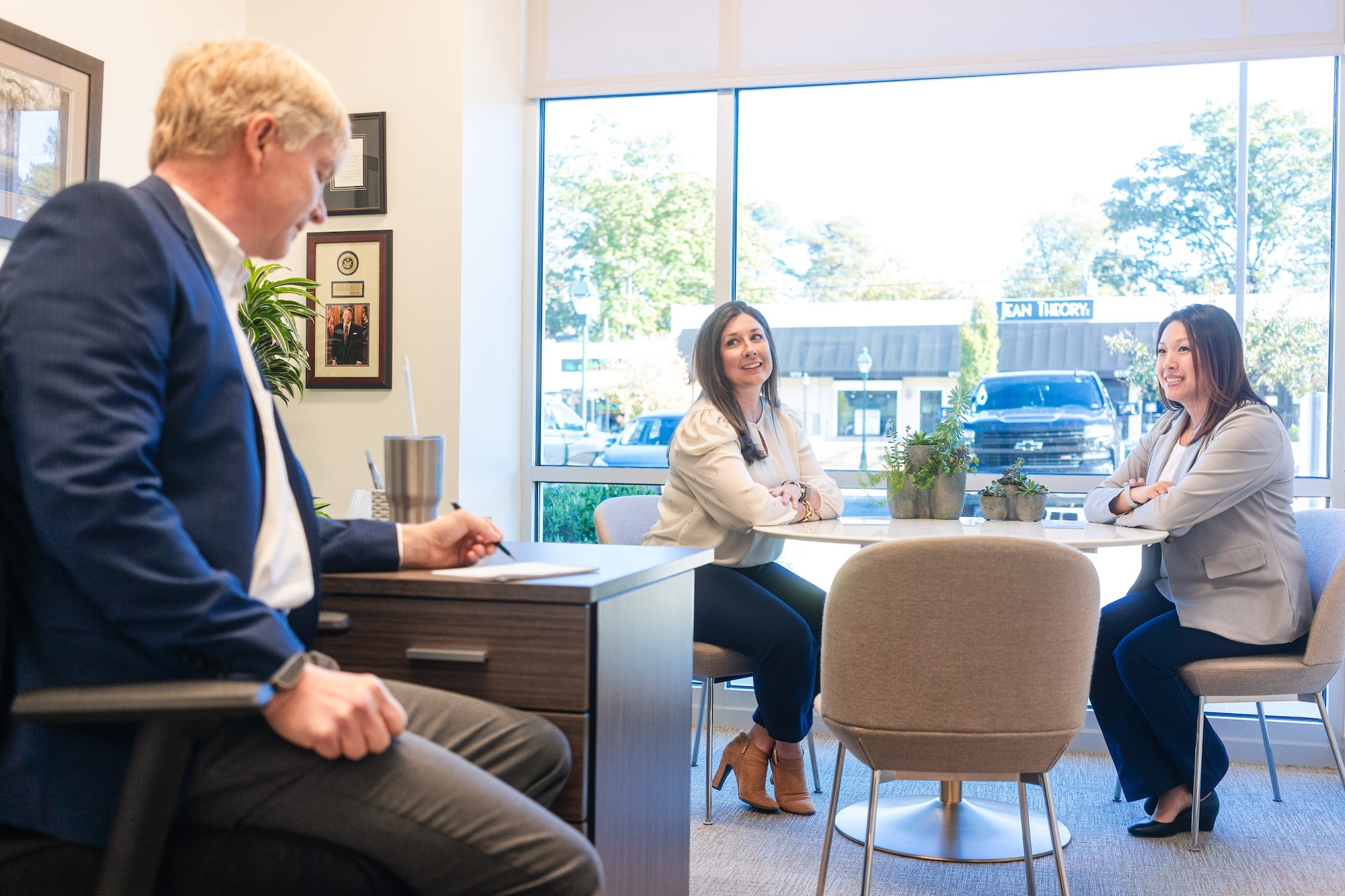 Three staff members working in the office